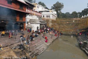 Pilgrims preparing a ritual at river Ganges, India