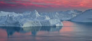 Pink sunset over Greenland's icebergs