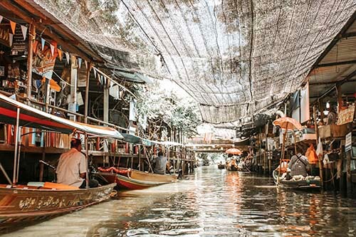 Soft light falls upon one of Bangkok's waterways