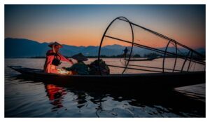 Fisherman having morning tea on Inle Lake