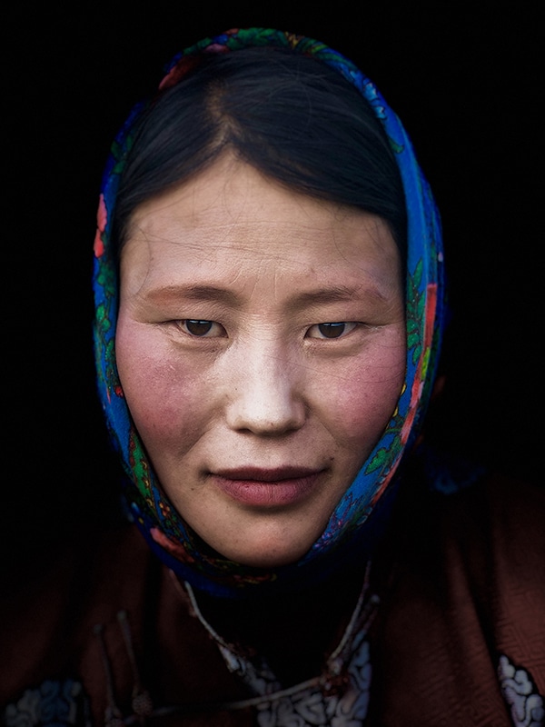 Protrait of mongolian woman with silk scarf wrapped her hair